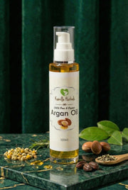 Kamille Herbals Argan Oil bottle in a botanical apothecary setting