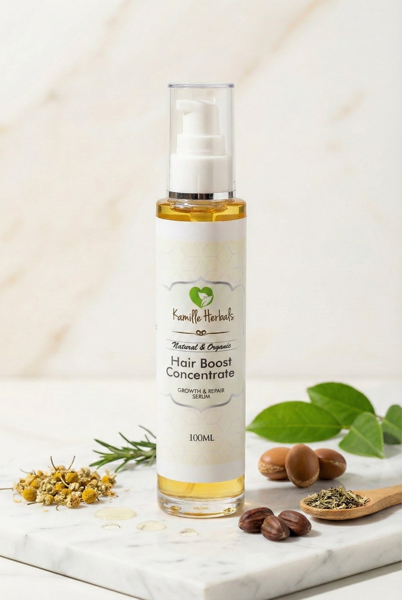 Hair boost concentrate bottle with natural ingredients on a marble surface